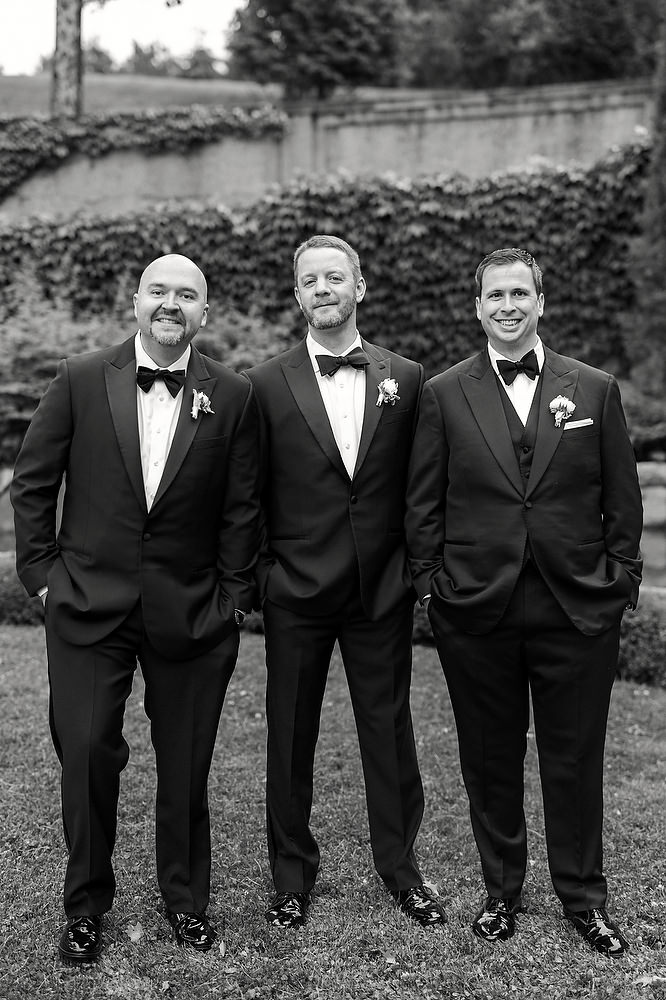 Groomsmen pose in tuxedos by Ralph Lauren at the Crane Estate