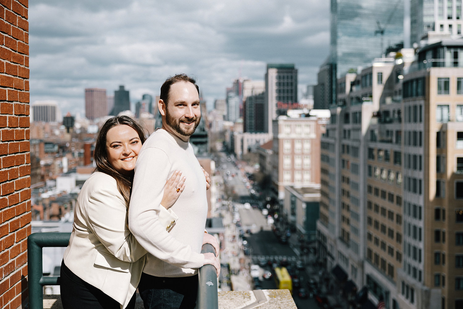 The couple is posing on Newbury Street in Boston