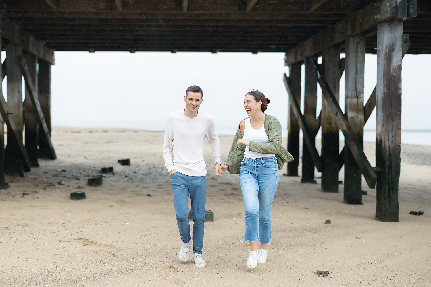 Digital portrait of couple walking hand in hand on Duxbury Beach at dusk