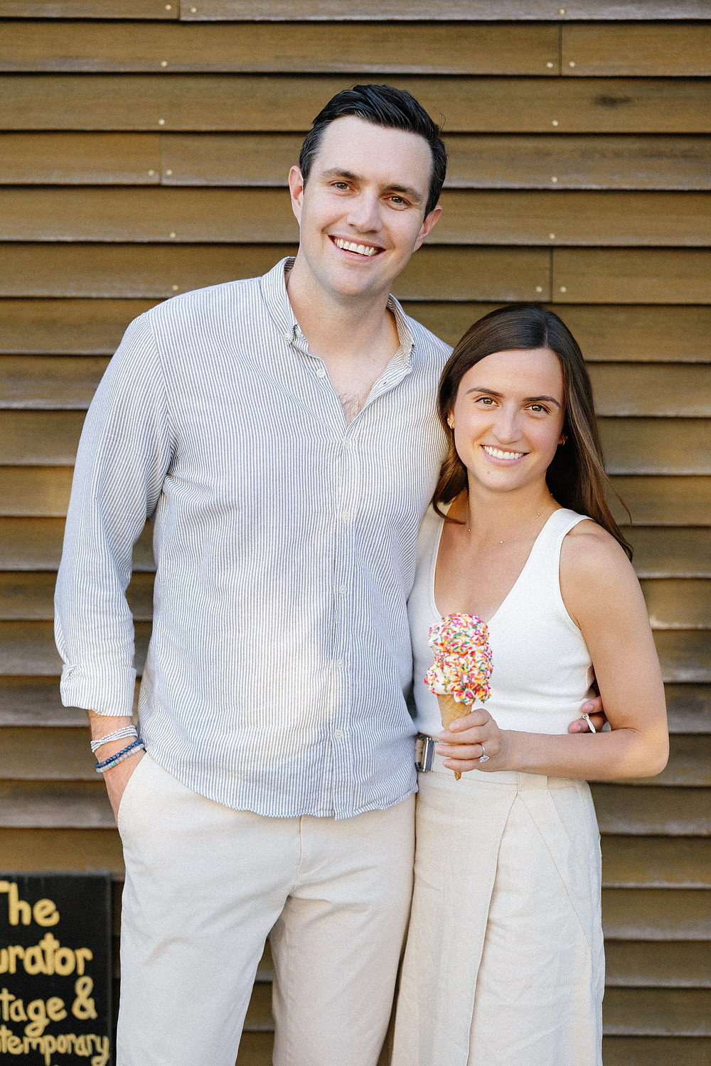 Couple sharing ice cream at Ben & Bills during Falmouth engagement session
