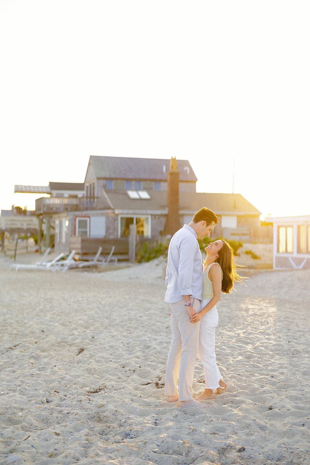 Sunset portraits of Brooke and Louis by the ocean in Falmouth MA
