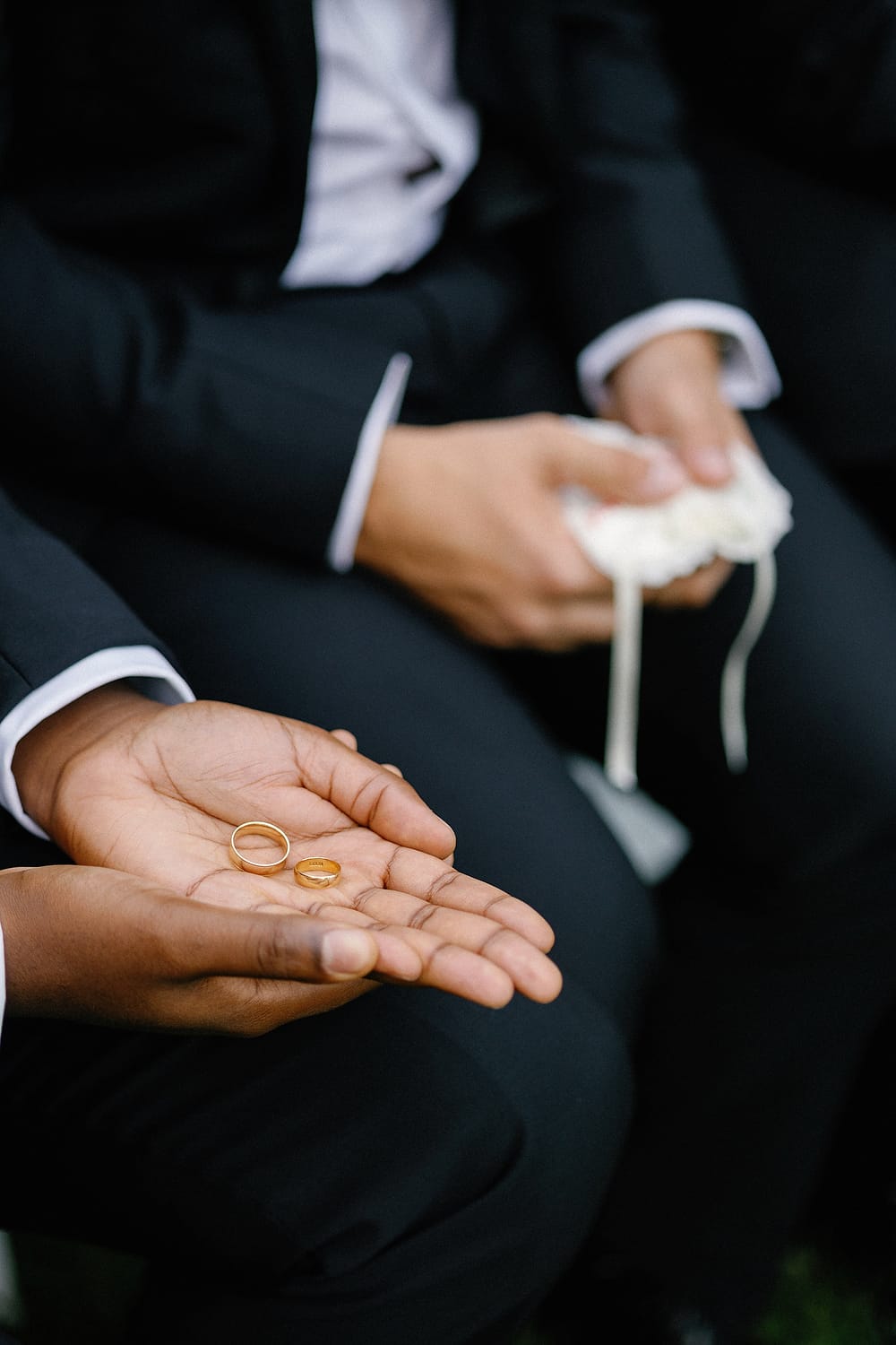 Close-up of hands and wedding rings captured on film