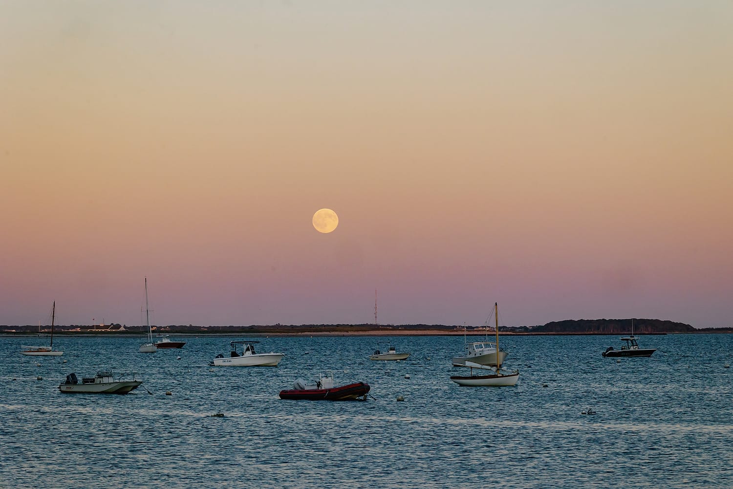 Sunset colors reflecting on water at Hyannis Port Yacht Club